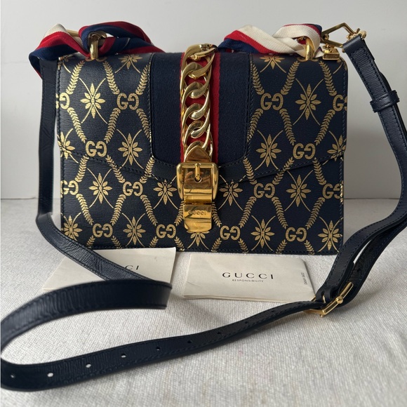Gucci Handbags - Gucci Black and Gold Crossbody Bag with Chain Strap
